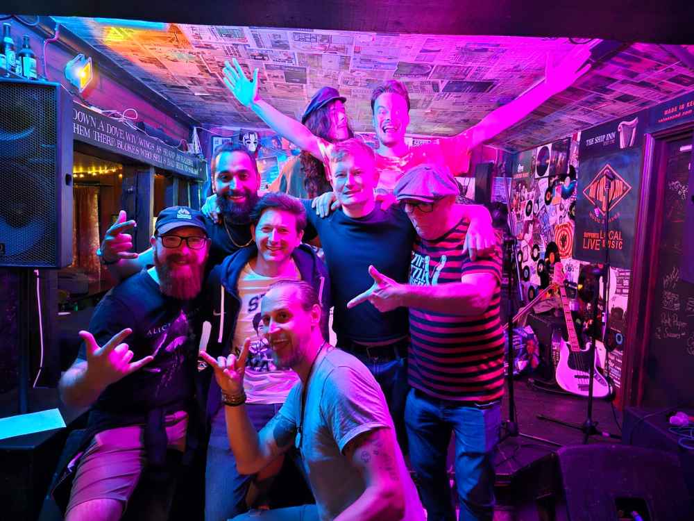 Band and fans posing