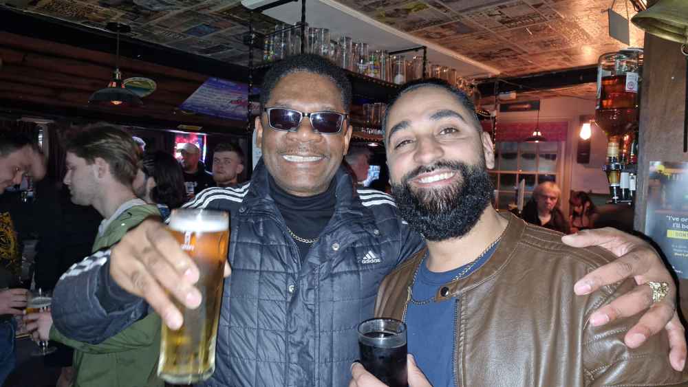 Band member posing with fan