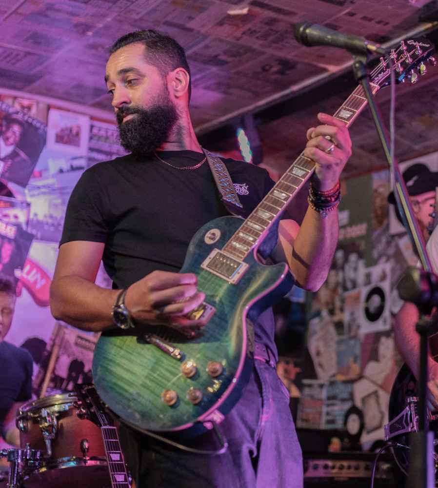 Member playing guitar